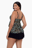 Woman turned left wearing a leopard print tankini top