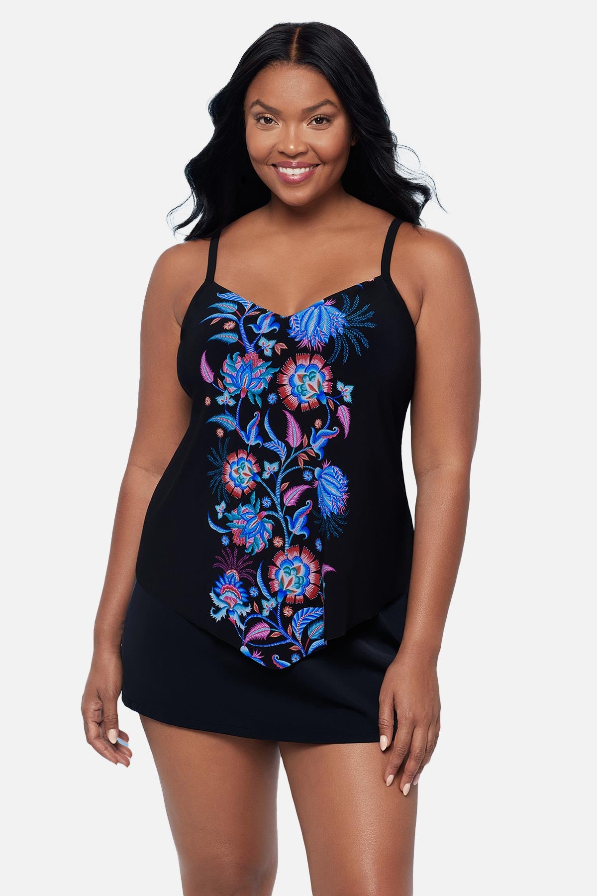 Woman wearing a black and blue floral tankini top