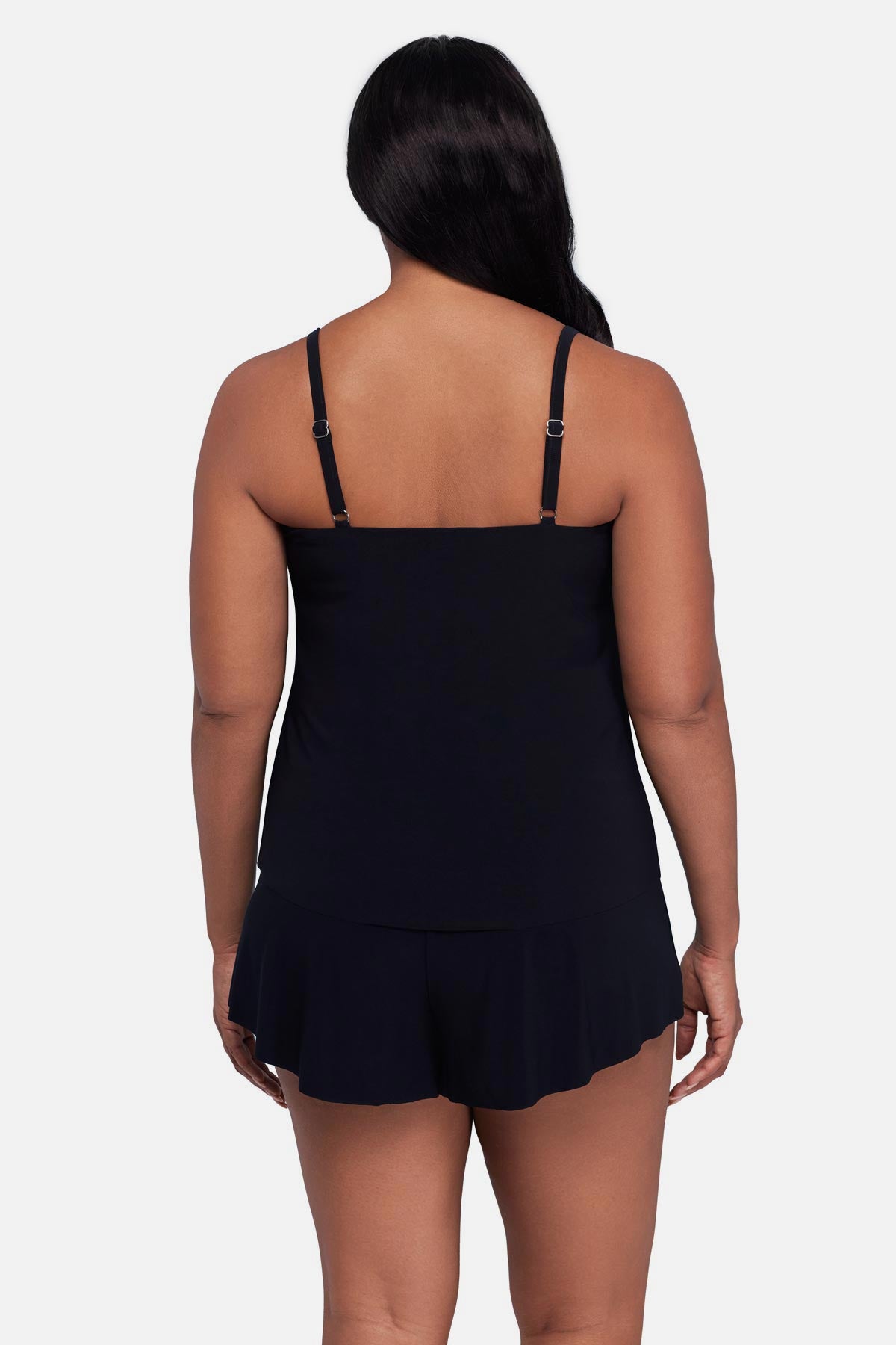 Woman turned away wearing a printed tankini top 