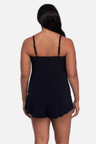 Woman turned away wearing a printed tankini top 