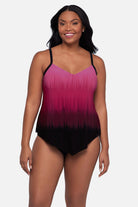 Woman wearing a pink ombre tankini top