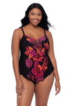 Woman wearing a pink and orange floral printed tankini top 