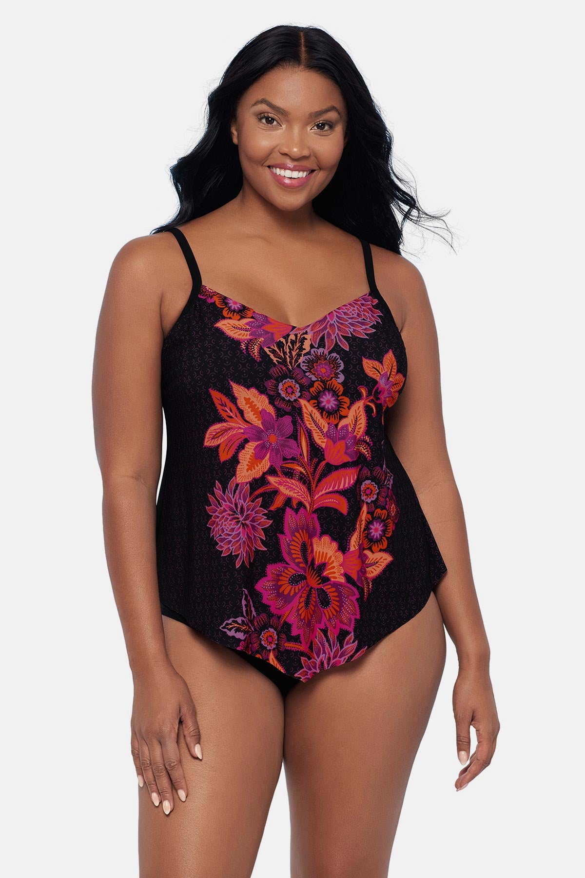 Woman wearing a pink and orange floral printed tankini top