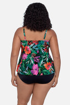 Woman turned away wearing a multicolor floral and leaf printed tankini top