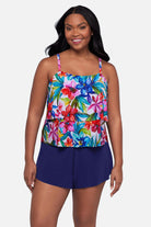 Woman wearing a multicolored floral printed swim romper with ruffles