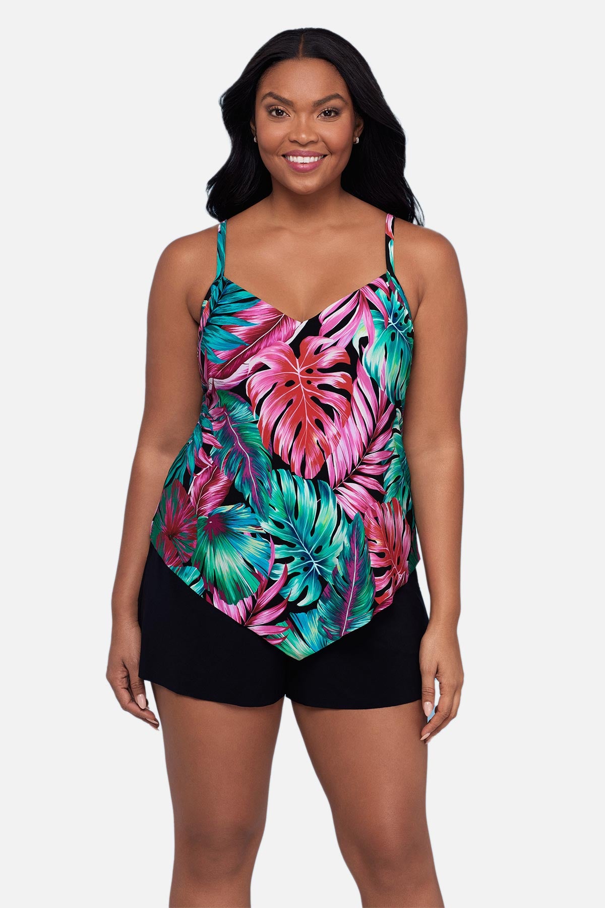 Woman wearing a multicolor palm leaf printed tankini top