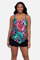Woman wearing a multicolor palm leaf printed tankini top