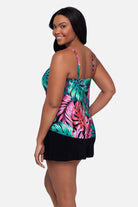 Woman turned left wearing a multicolor palm leaf printed tankini top