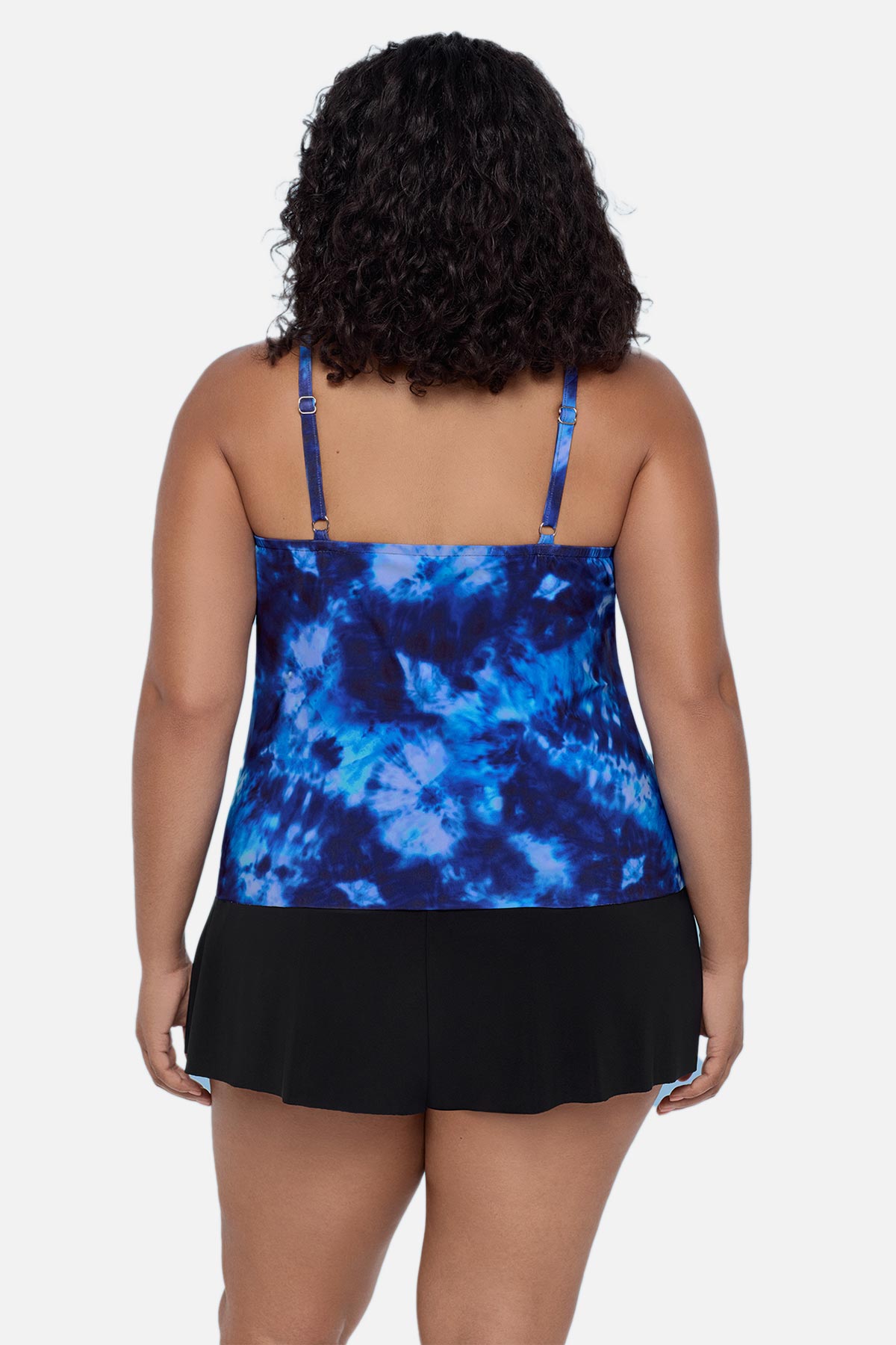 Woman turned away wearing a blue tie dye swim romper