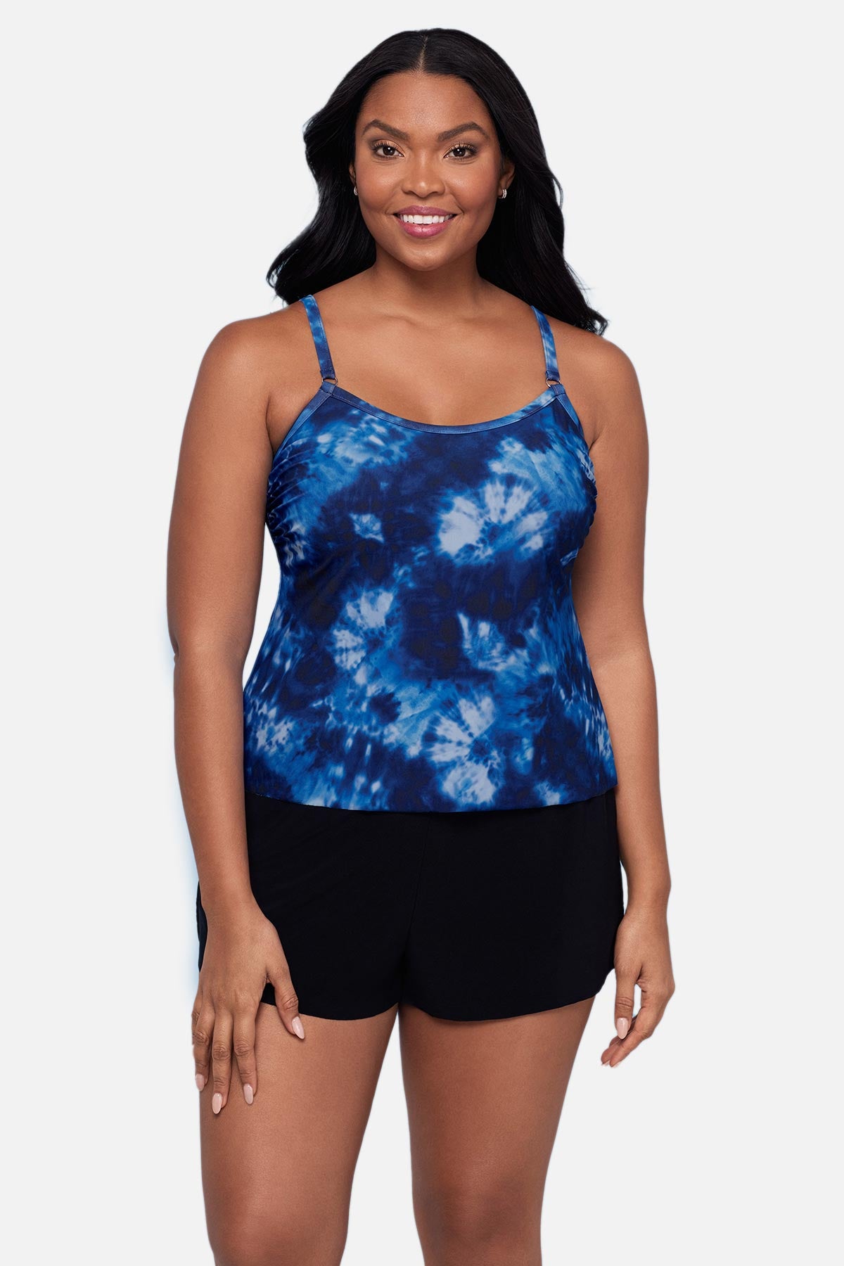 Woman wearing a blue tie dye swim romper 