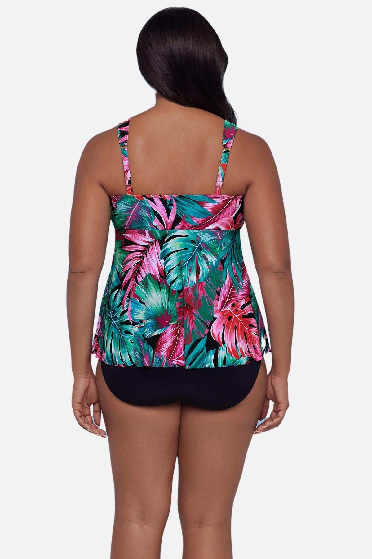 Woman turned away wearing a multicolor palm leaf printed tankini top