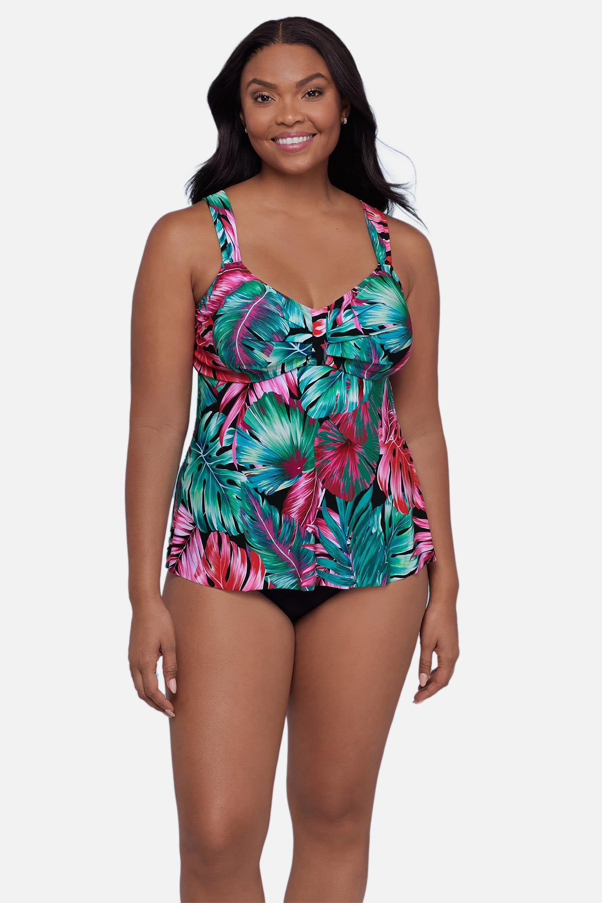 Woman wearing a multicolor palm leaf printed tankini top