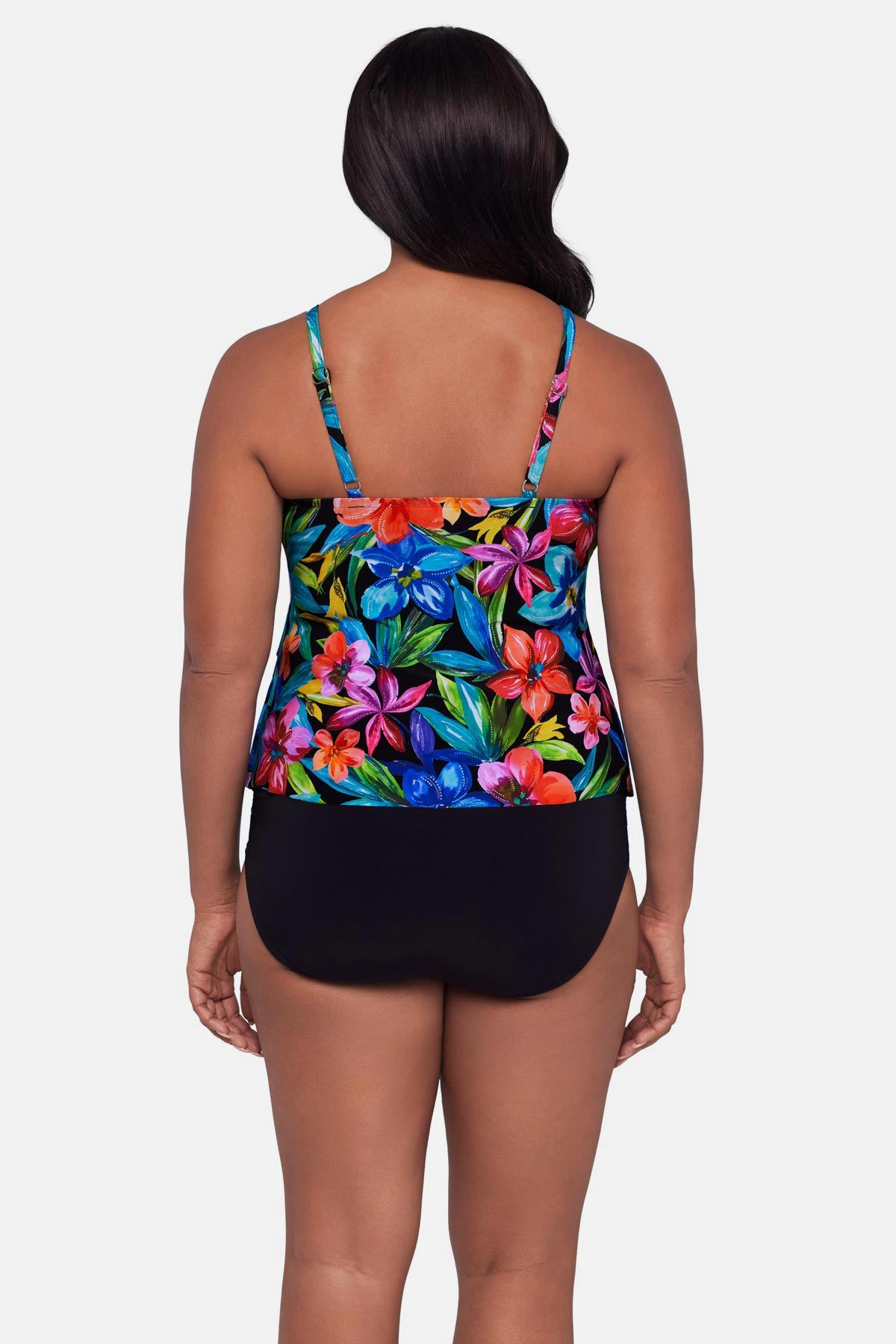 Woman turned away wearing a multicolored floral printed tankini top with ruffles