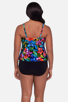 Woman turned away wearing a multicolored floral printed tankini top with ruffles