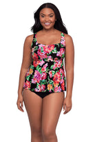 Woman wearing a pink floral print tankini top