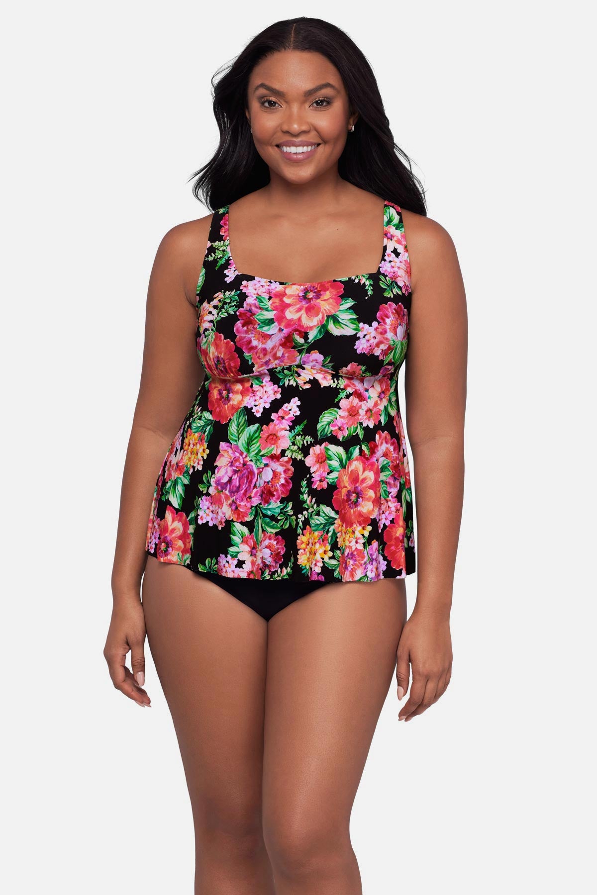 Woman wearing a pink and orange floral printed tankini top