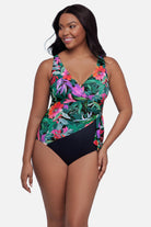 Woman wearing floral and leaf printed multicolor one-piece swimsuit