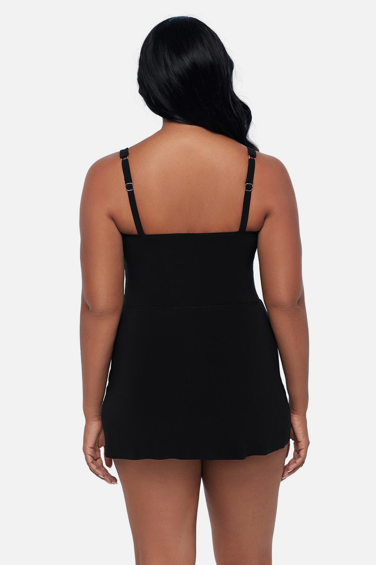 Woman turned away wearing a black swim dress 