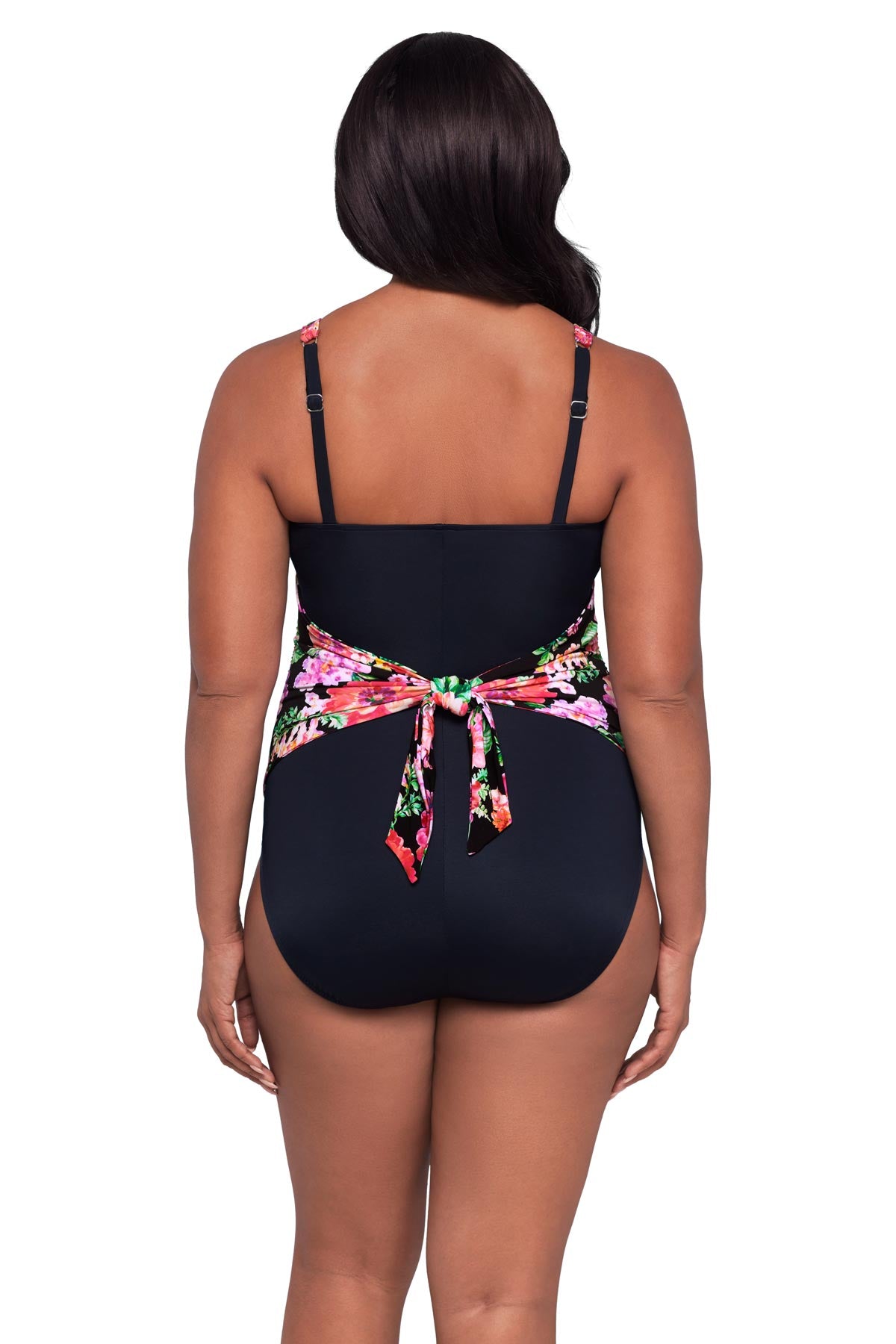 Woman turned away wearing a pink floral printed one-piece swimsuit