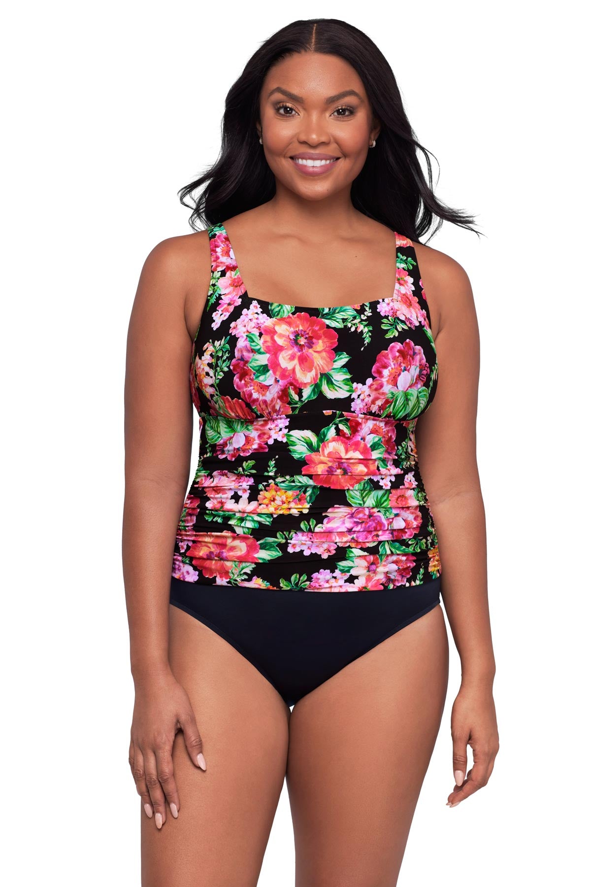 Woman wearing a pink floral printed one-piece swimsuit