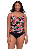 Woman wearing a pink floral printed one-piece swimsuit