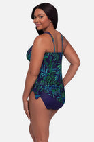 Woman turned left wearing a blue and green jungle printed swim dress