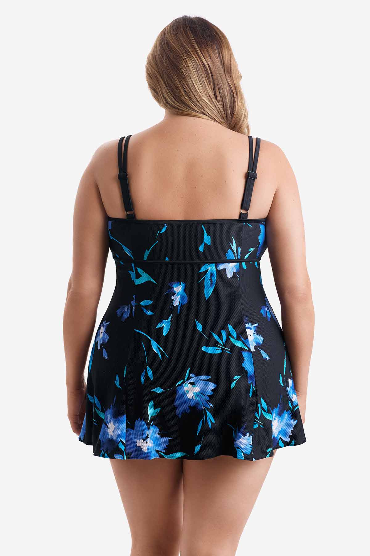 Woman turned away wearing a blue floral printed swim dress