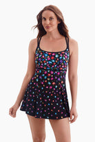 Woman wearing a multicolored floral printed swim dress