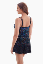 Woman turned left to show pattern detail on swim dress