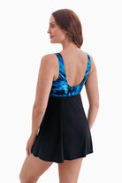 Woman faced left to show detail of swim dress
