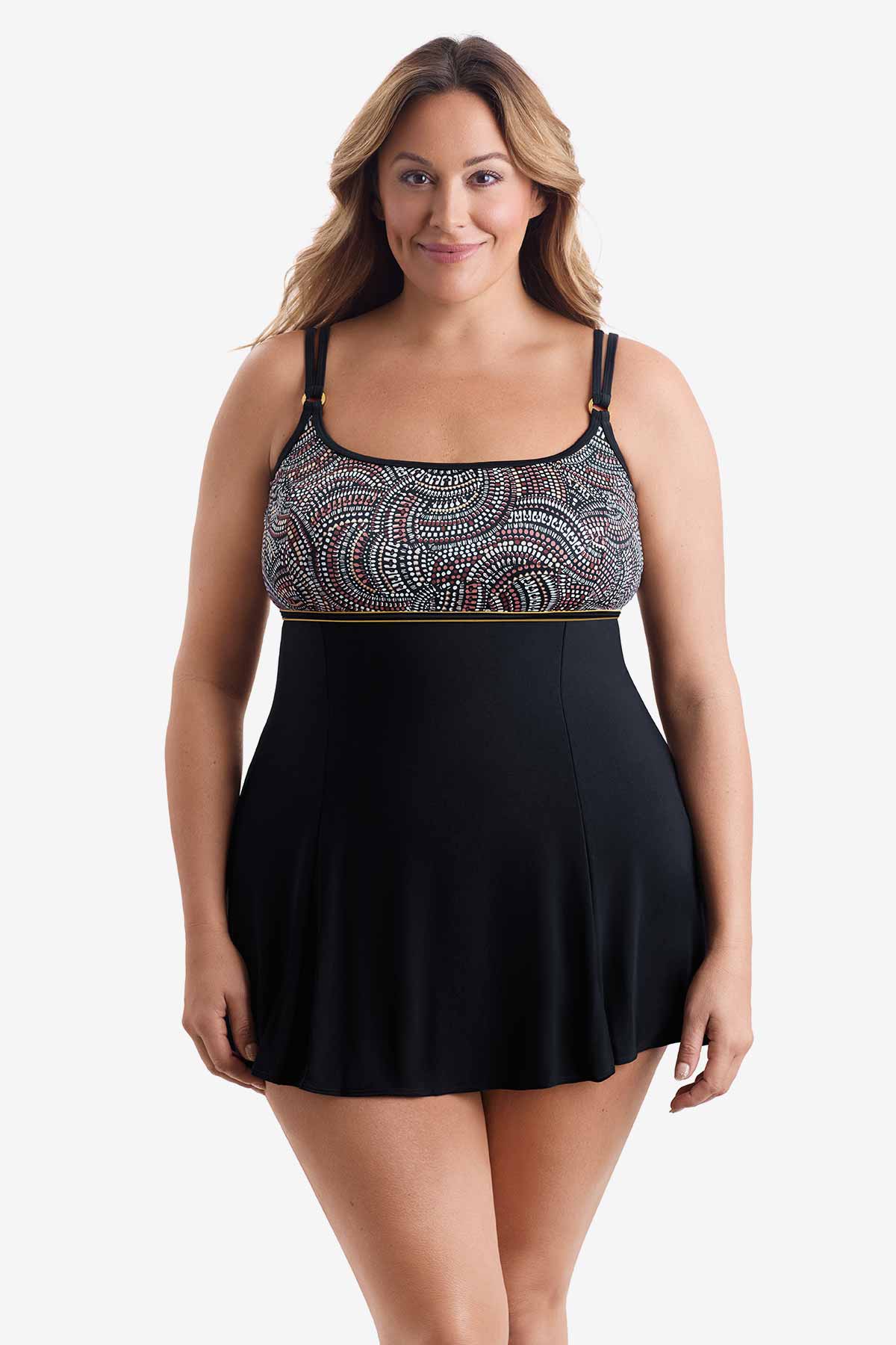 Woman wearing a swim dress with multicolored dots on the bust