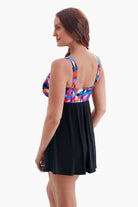 Woman turned left wearing a swim dress 