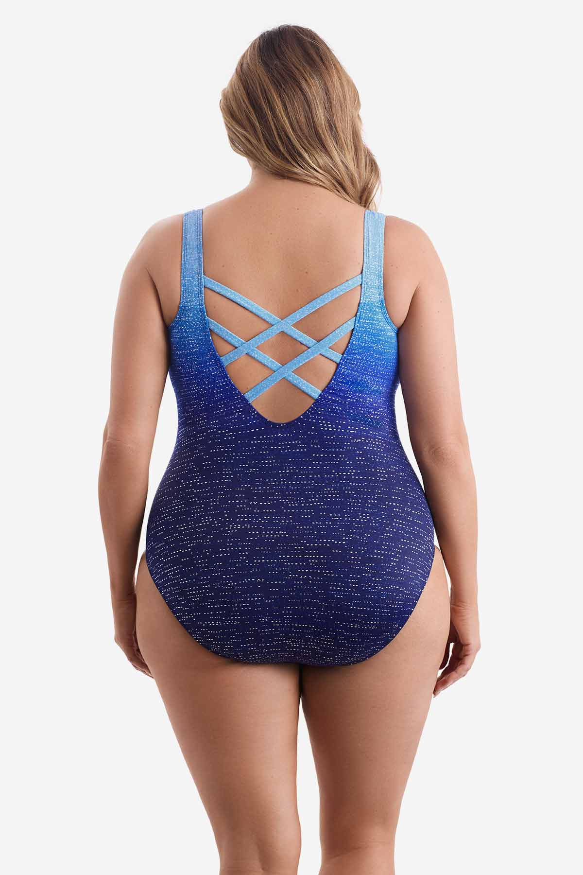 Woman turned away wearing a blue ombre one-piece swimsuit