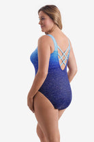 Woman turned left wearing a blue ombre one-piece swimsuit