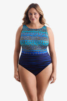 Woman wearing a one-piece swimsuit with a dual pattern in blue