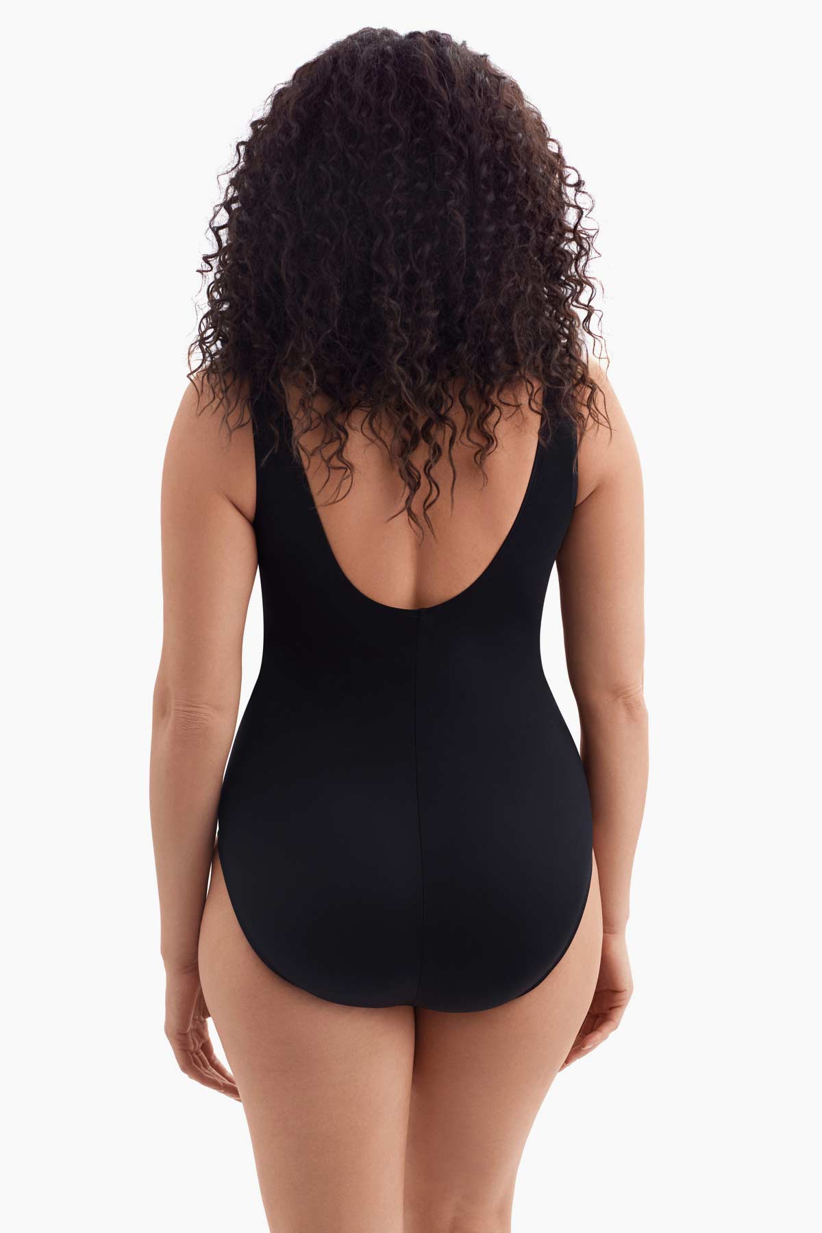 Woman turned away wearing a one-piece swimsuit 