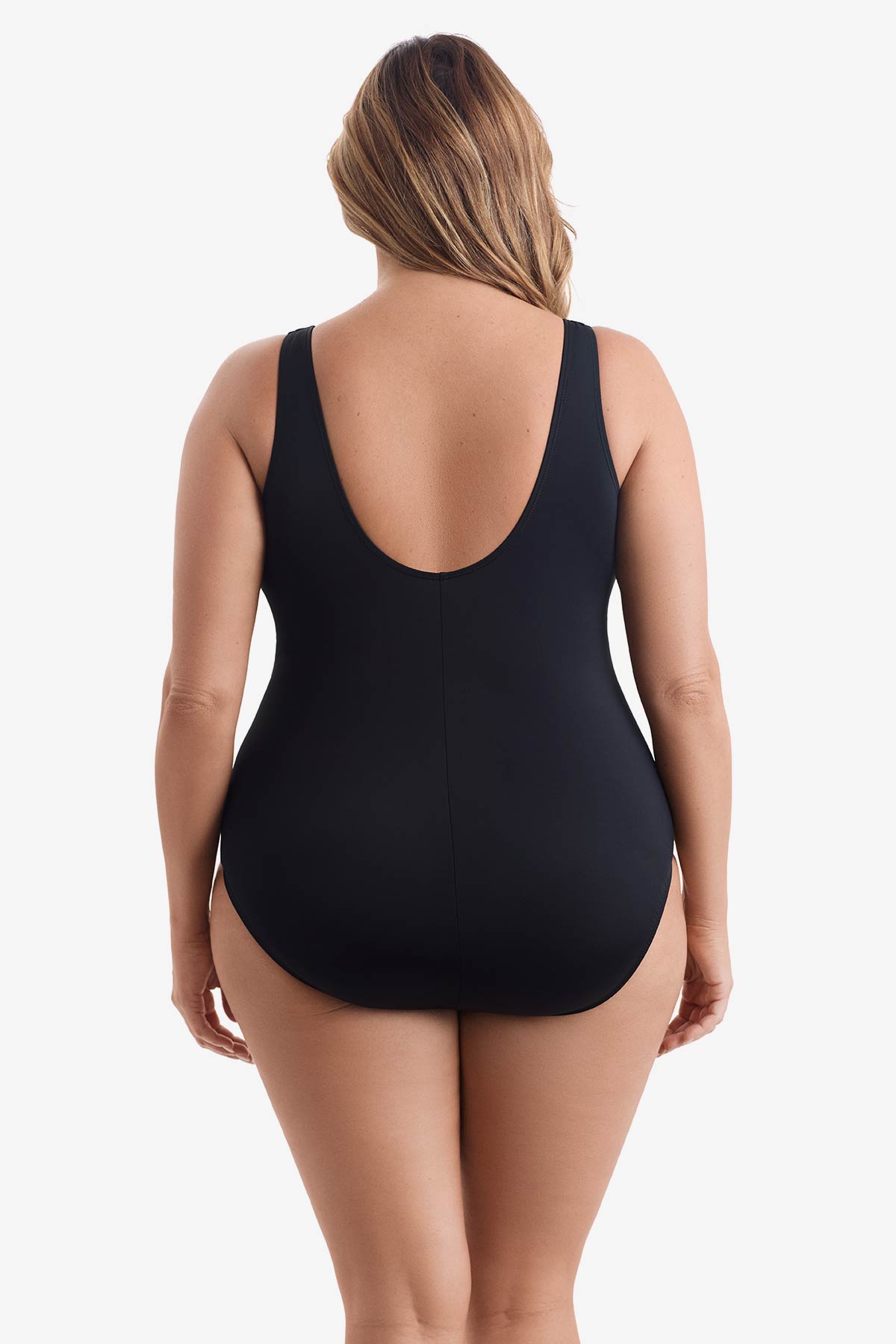 Woman faced away wearing a black one-piece swimsuit 