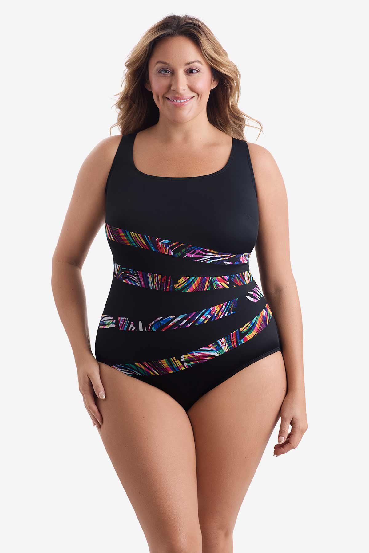 Woman wearing a black one-piece swimsuit with four rainbow streaks across the front