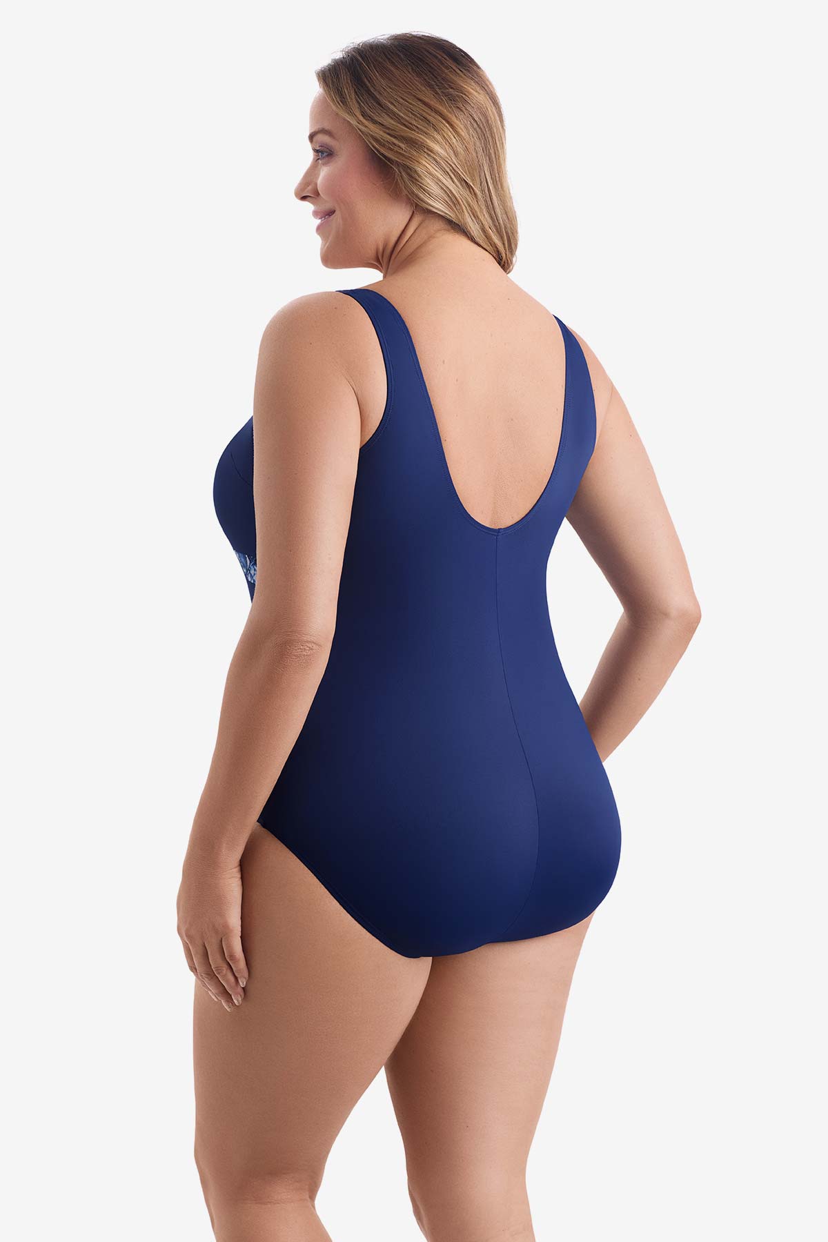 Woman faced left wearing a blue one-piece swimsuit 