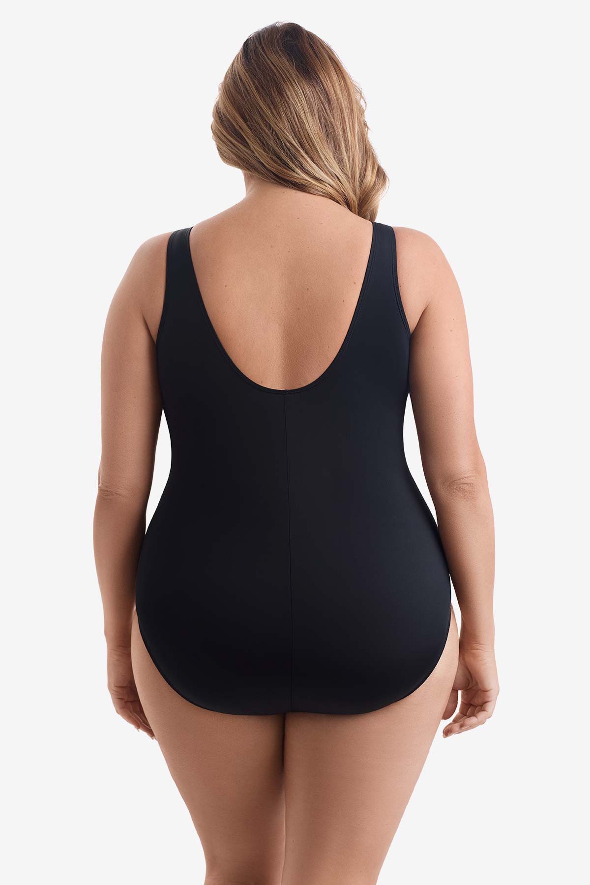 Woman faced away wearing a black one-piece swimsuit 