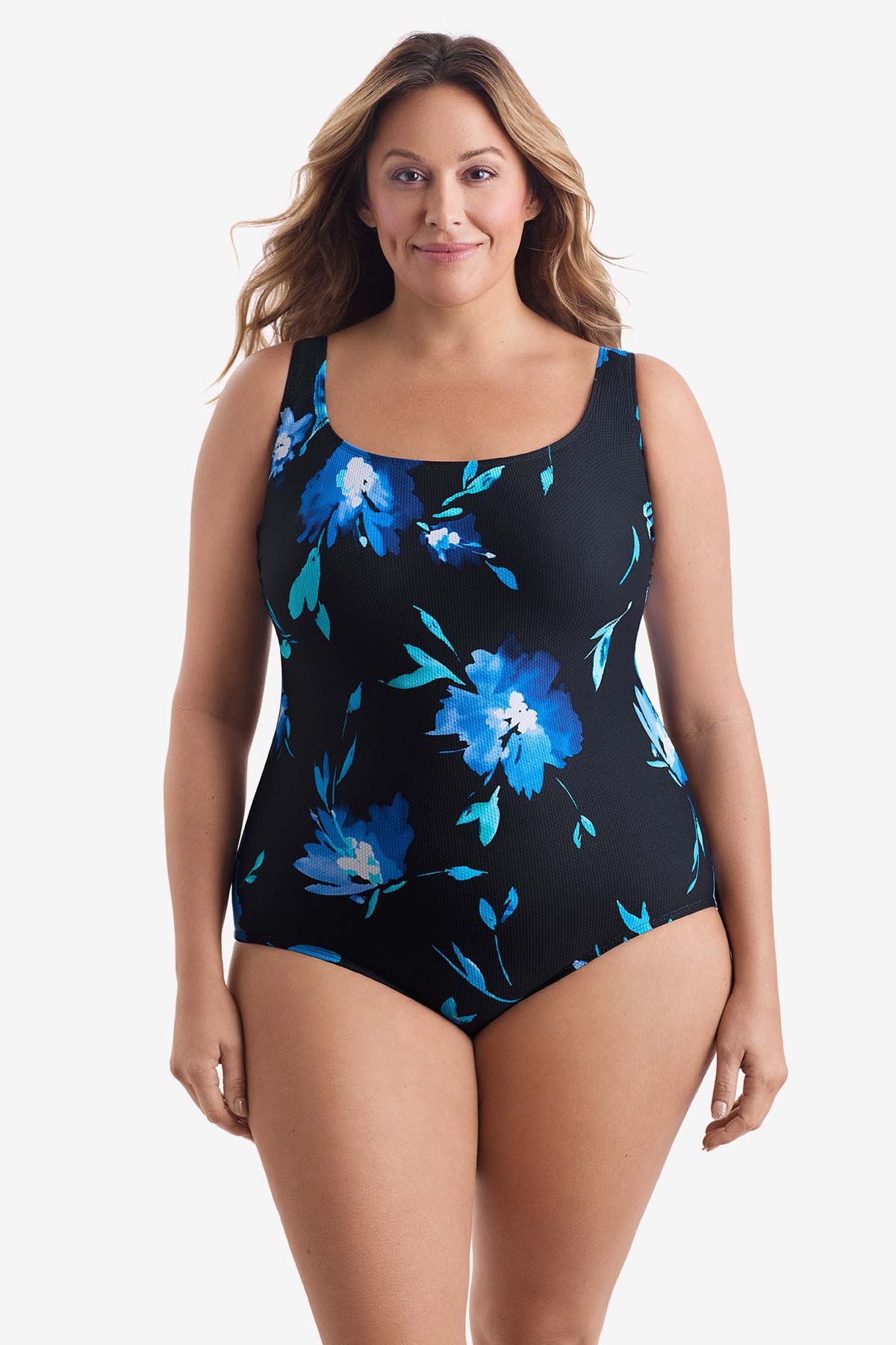 Woman wearing a large blue floral printed one-piece swimsuit