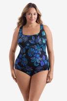 Woman wearing a blue flower printed one-piece swimsuit