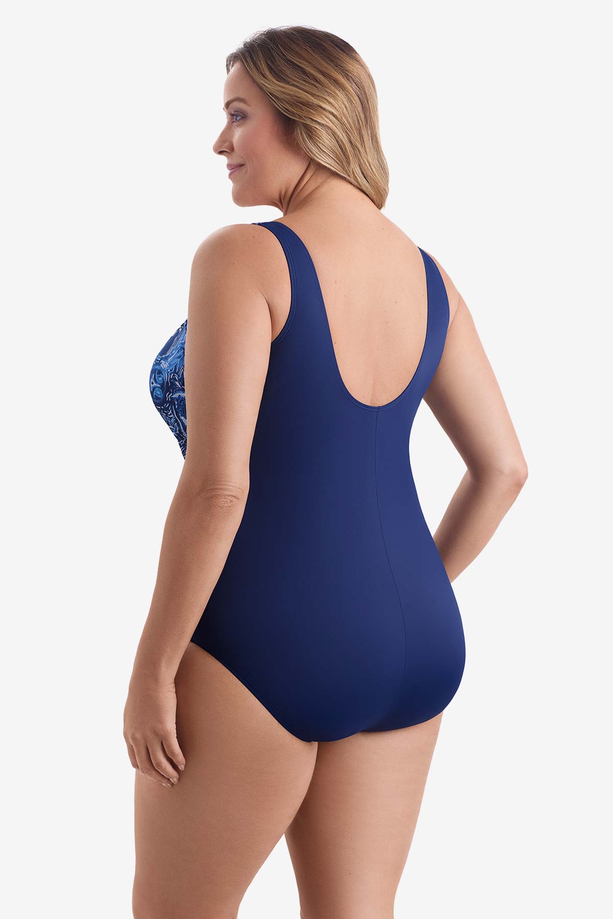 Woman faced left wearing a blue and white abstract printed one-piece swimsuit
