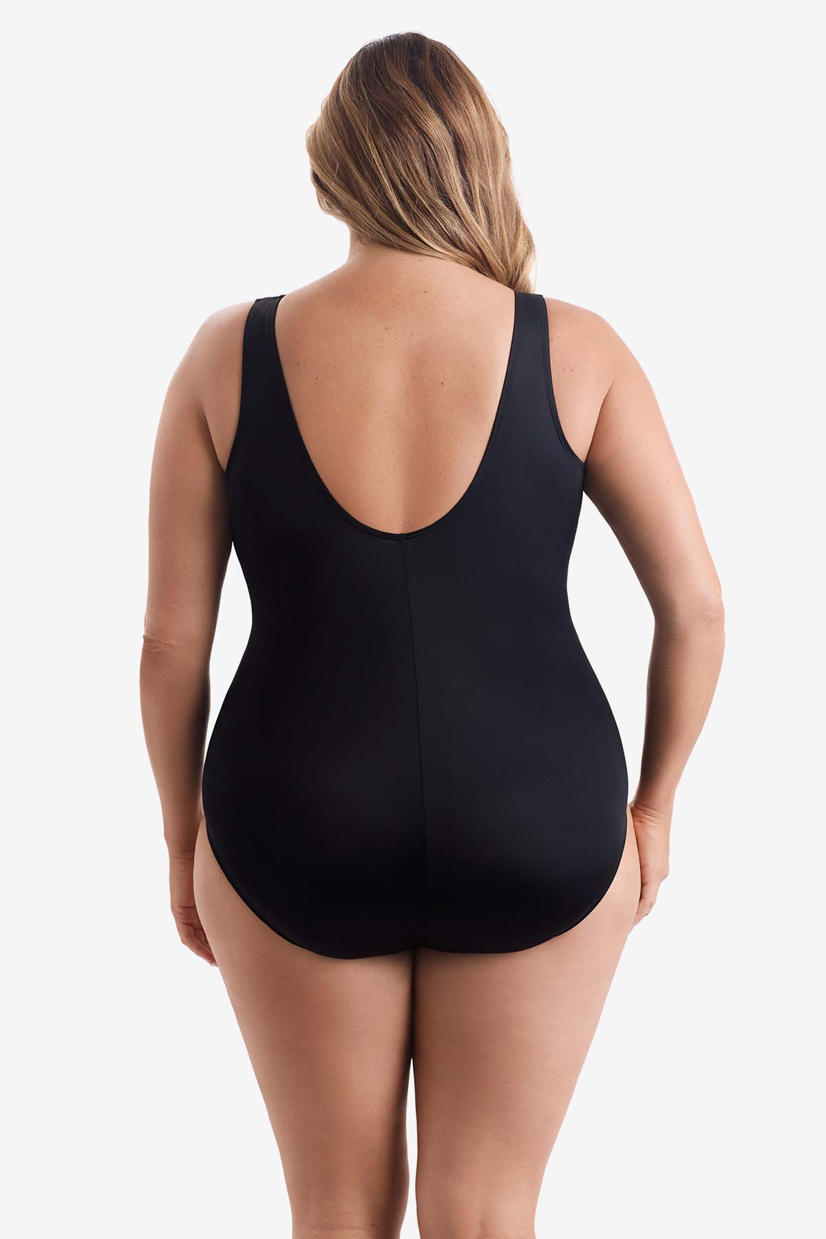 Woman faced away wearing a black one-piece swimsuit