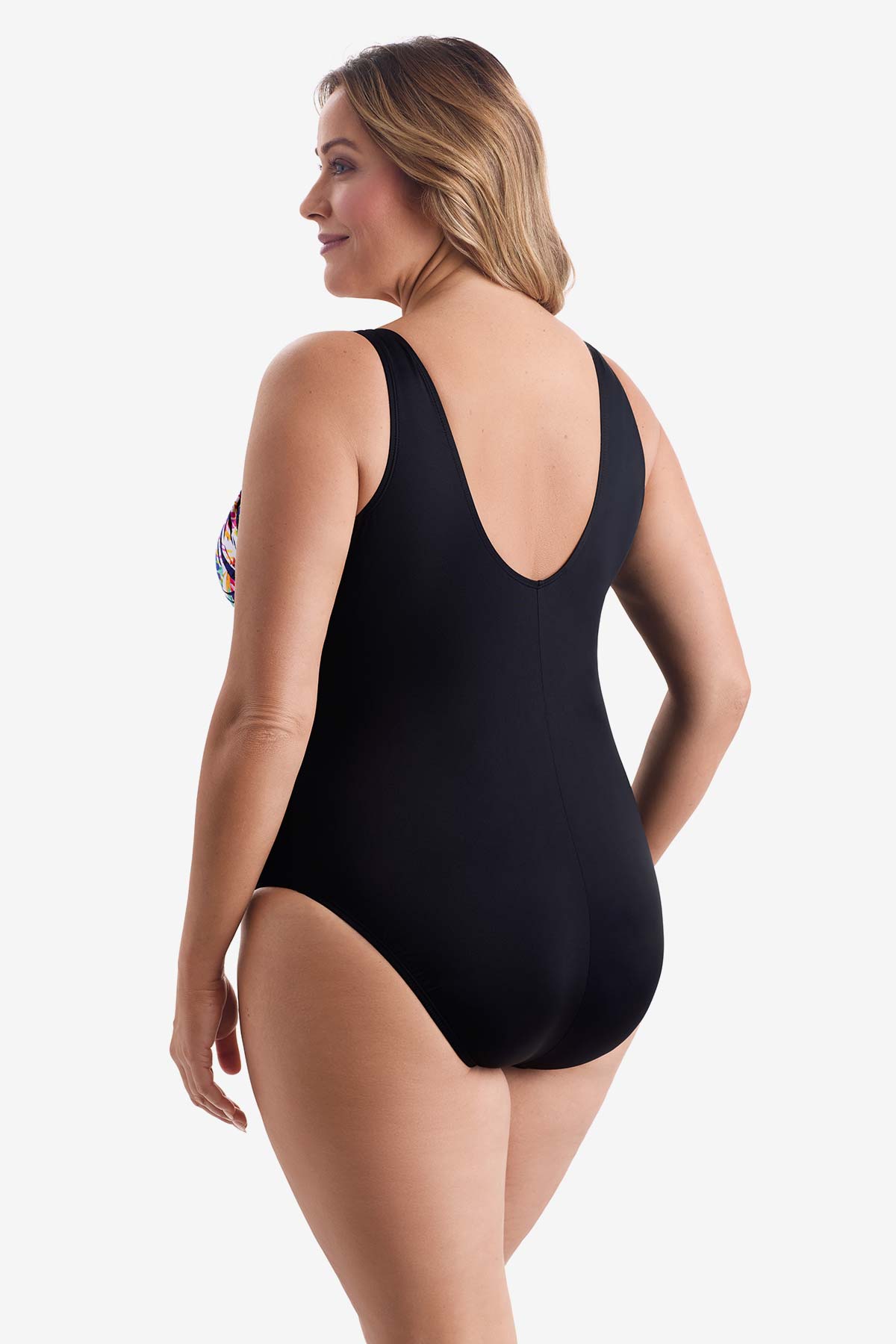 Woman turned left wearing a rainbow abstract printed one-piece swimsuit