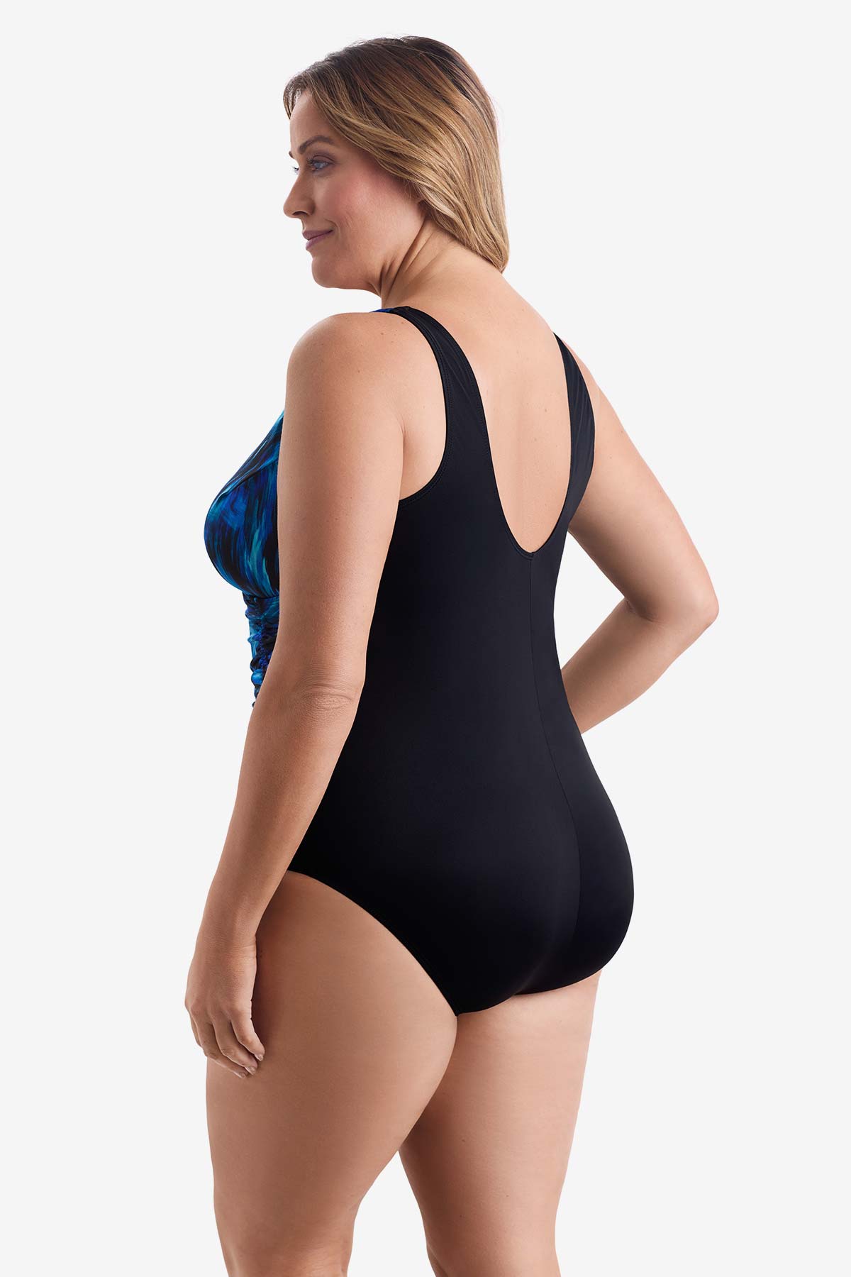 Woman turned left wearing a black and blue feathered pattern one-piece swimsuit