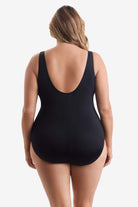 Woman wearing a black one-piece swimsuit