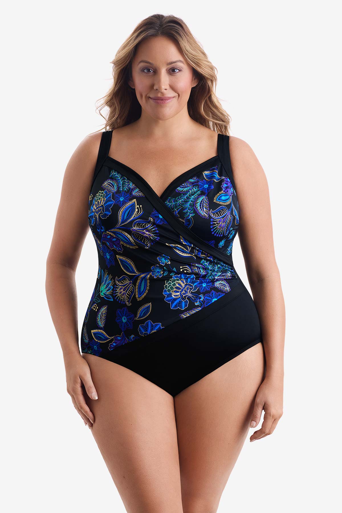 Woman wearing a blue and gold flower printed one-piece swimsuit