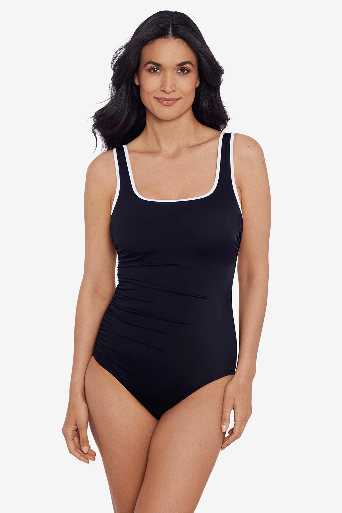 Woman wearing a black one-piece swimsuit with white piping on the straps