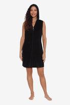 Woman wearing a black swim cover up with a zipper down the front with the hood up